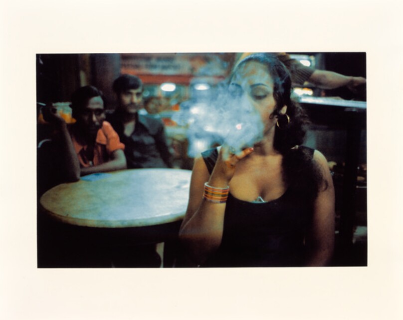 Transwoman smoking in the Olympia Cafe, Bombay, India