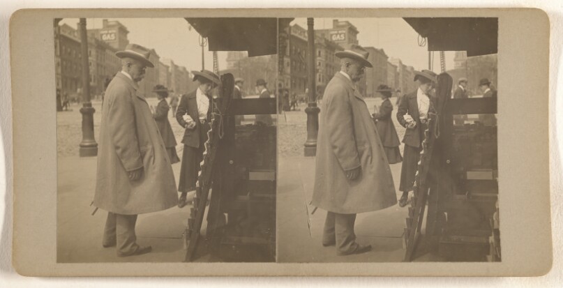 [Elder man with hat reading newspapers at rack, Albany, N.Y.]