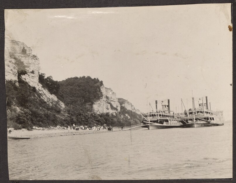[Two steamboats on a river]