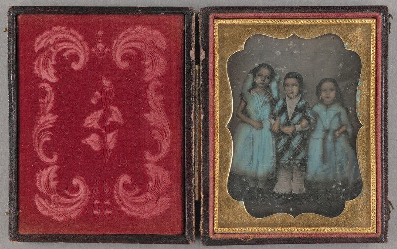 [Portrait of Standing Two Girls and a Boy, arm-in-arm]