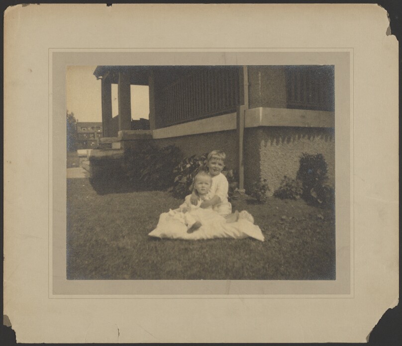 [Two children on a lawn]