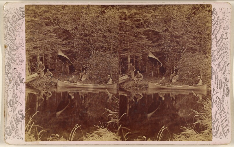 [Group of men on shore of St. Regis River, two in canoe, one with canoe on head]