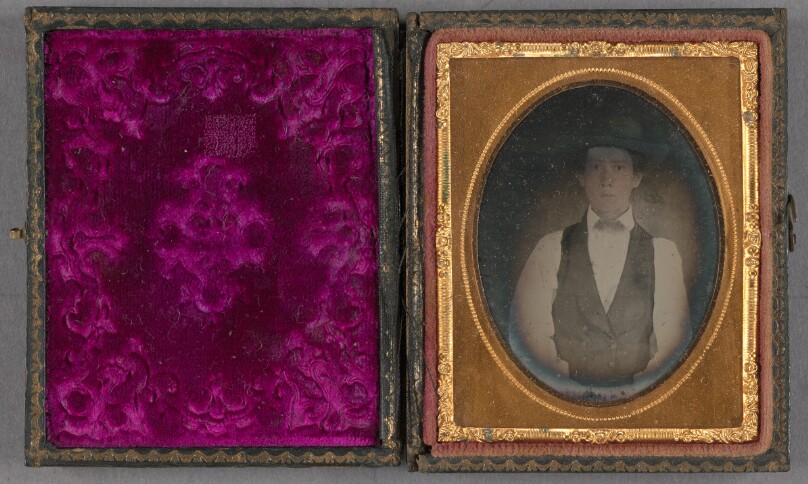 [Portrait of a young man wearing a wide-brimmed hat]