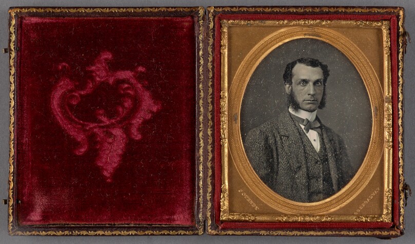 [Portrait of a young man with muttonchop whiskers]