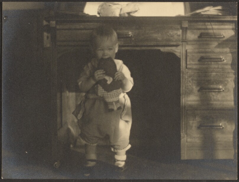 [Baby Chewing on Doll]