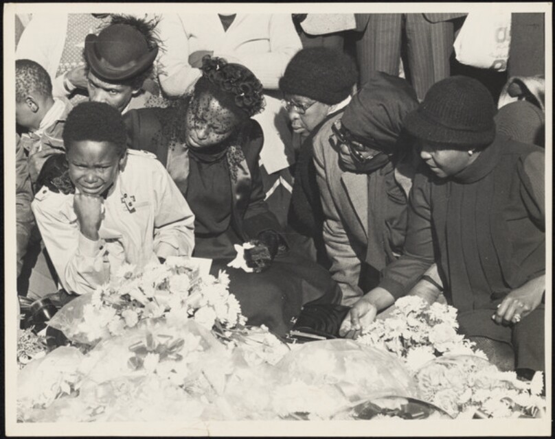 Untitled [Funeral, young boy crying]