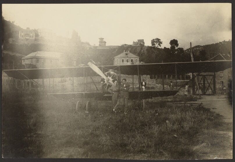 [Portrait of couple in front of airplane]