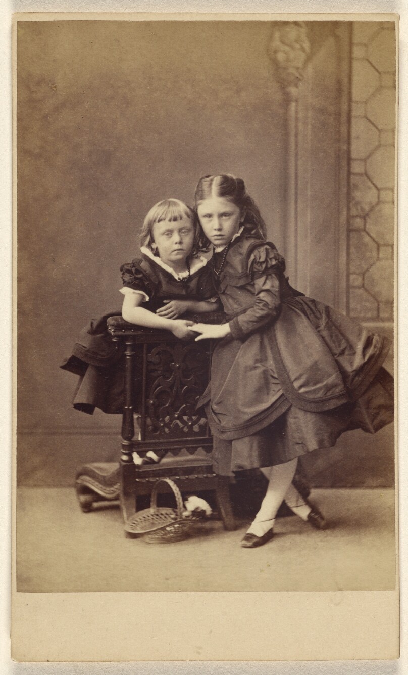 [Two unidentified girls, standing]