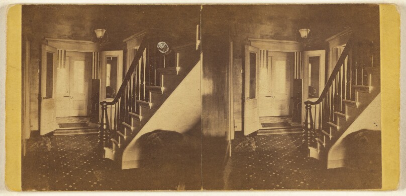 [Interior view with stairway and door]