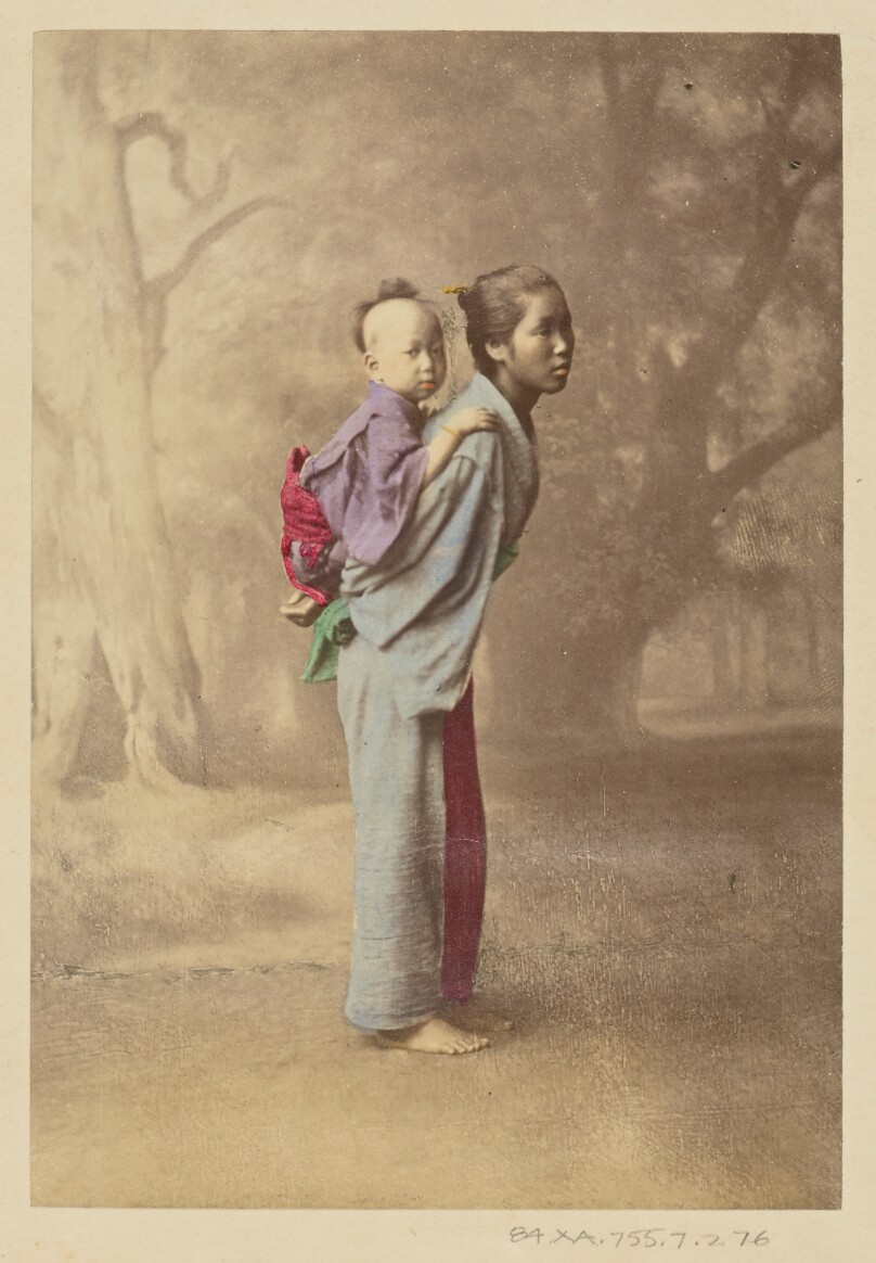 [Japanese woman carrying her baby on her back]