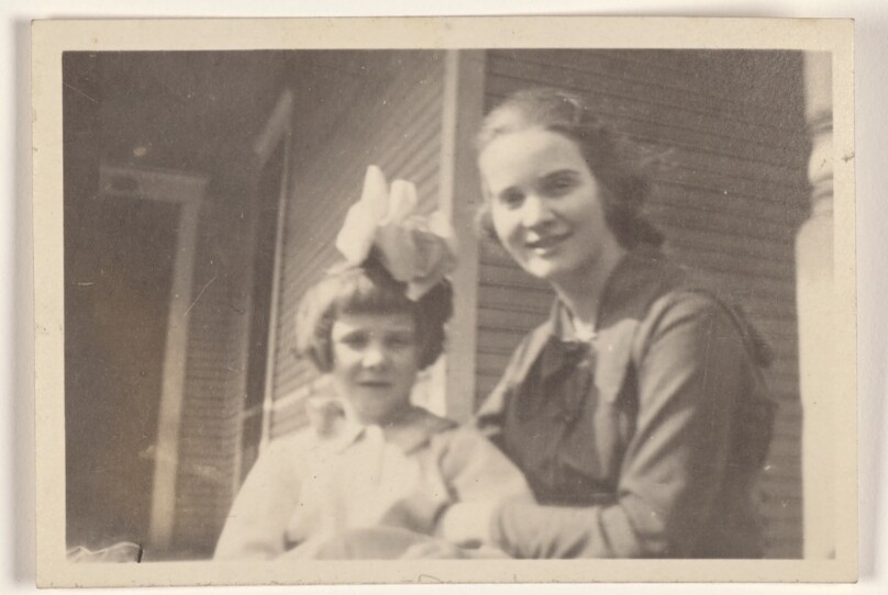 [Woman and girl on a porch]