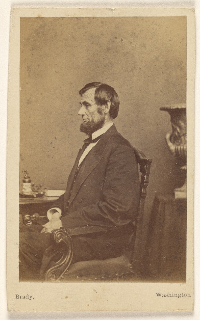 [Abraham Lincoln seated, in profile]