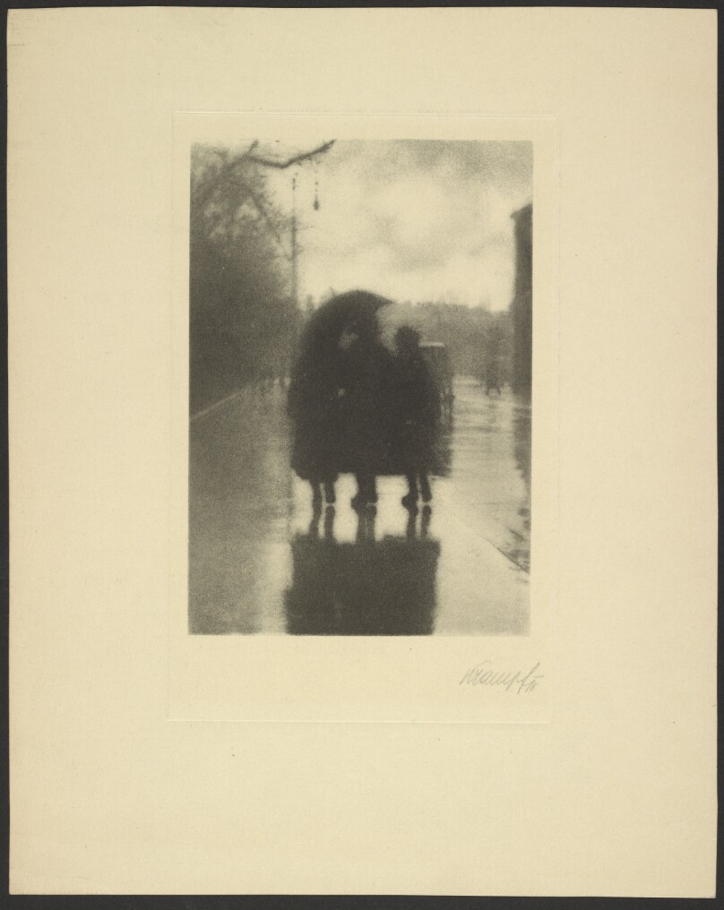 [Three figures in the rain]