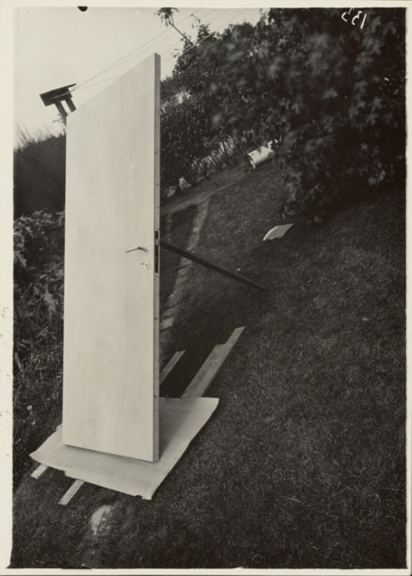 [Wooden Door on Lawn]