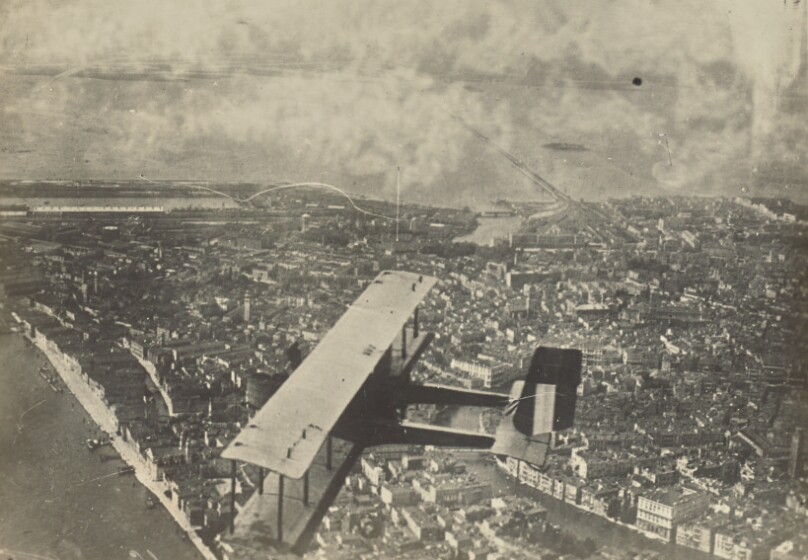 [Aerial shot of an airplane over Venice]