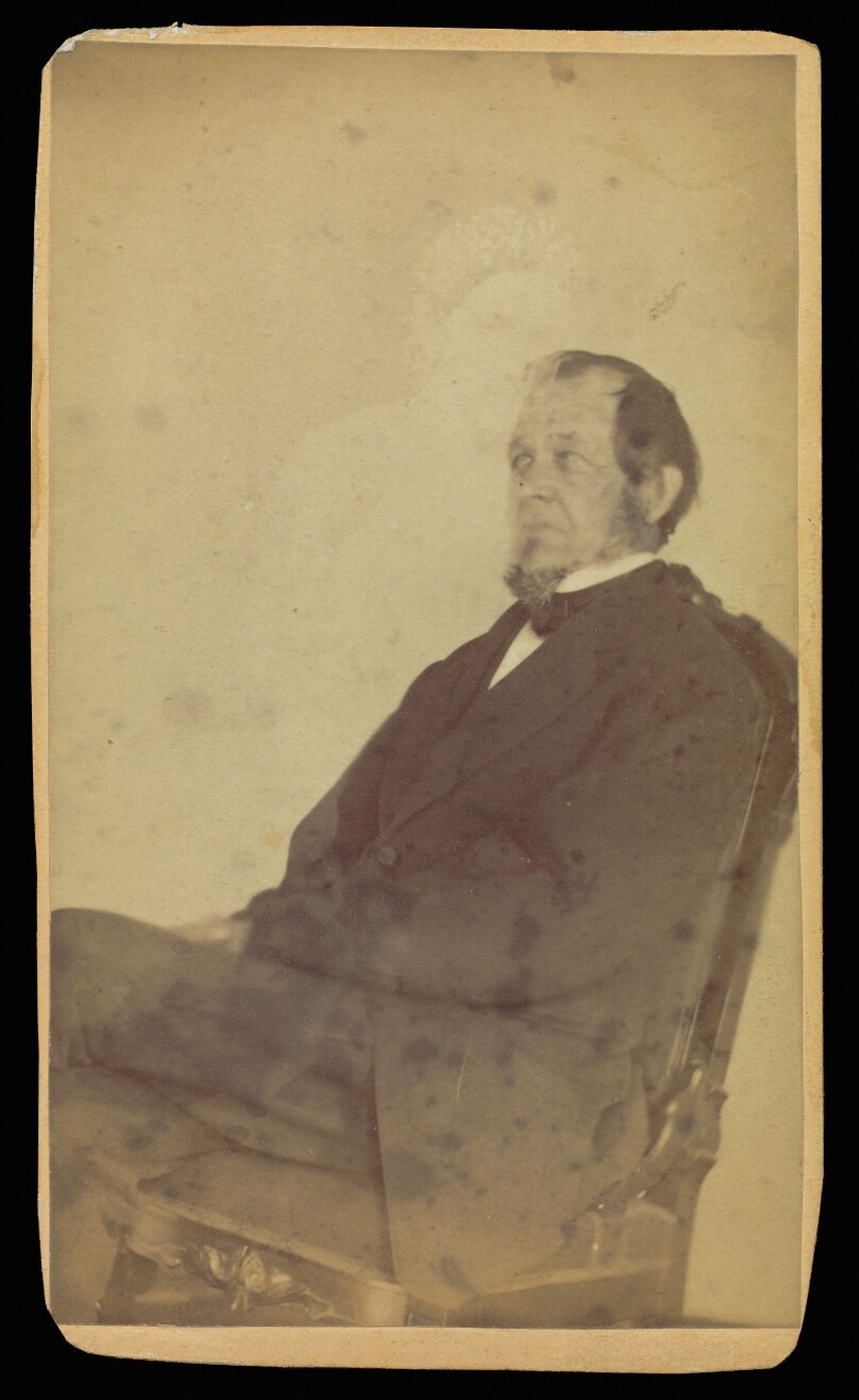 [Unidentified man seated with female "spirit"]
