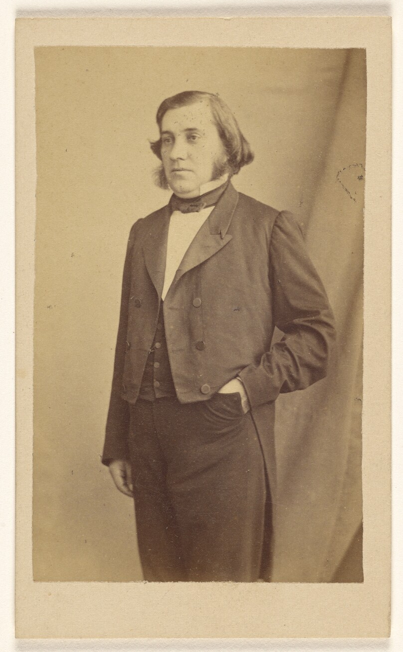 [Unidentified man with muttonchops, standing]
