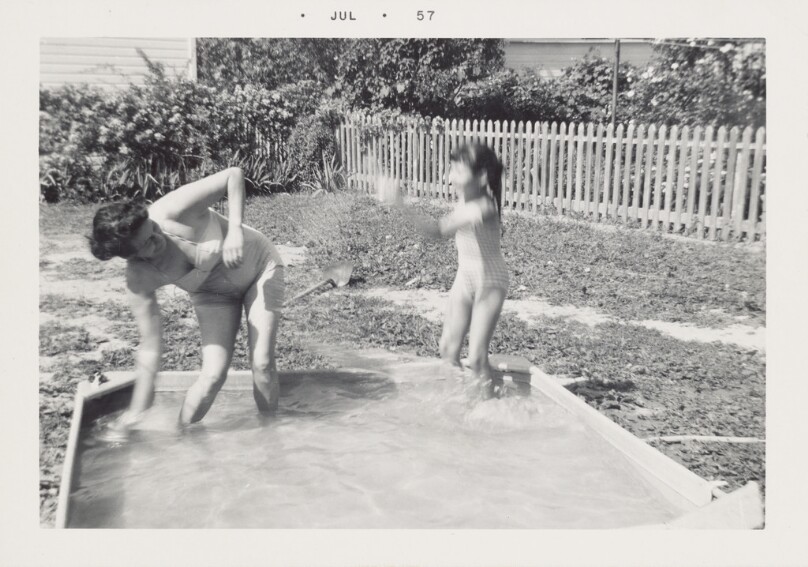 [Woman and child playing in pool]