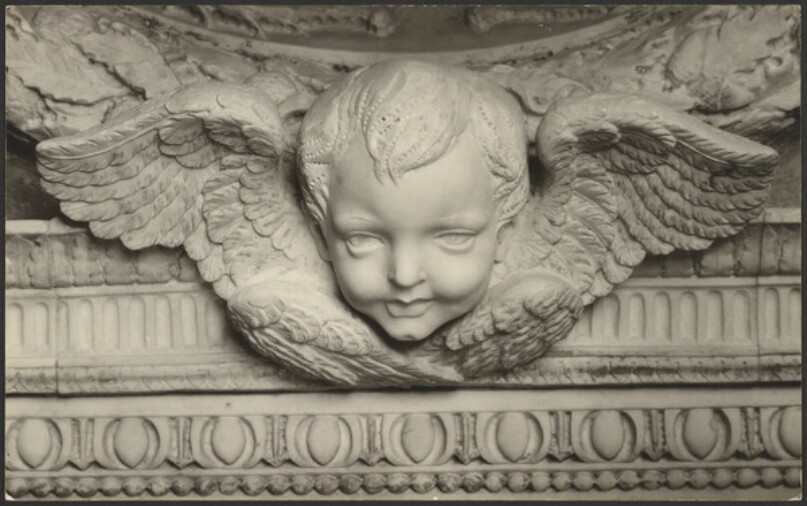 [Detail of angel head sculpture]