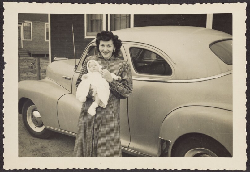 [Woman holding a baby]
