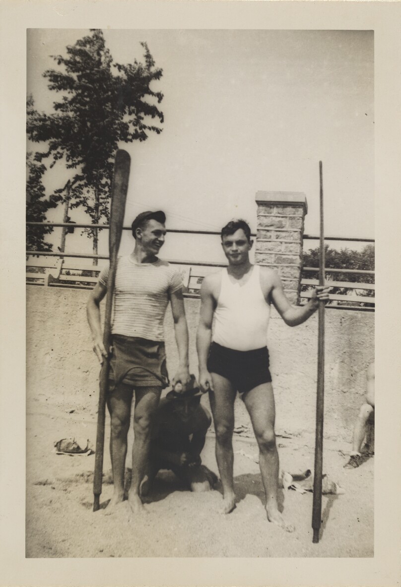 [Three men on the beach]