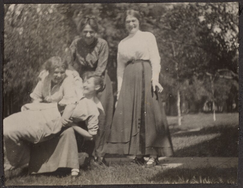 [Four women laughing]