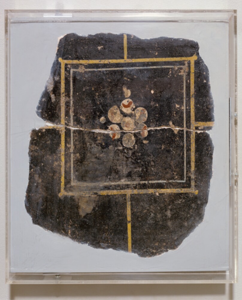 One Fragment of a Black Ground Frescoed Wall