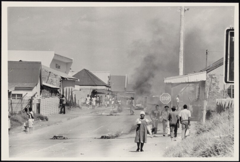 Untitled [Smoke-filled street, "stop" sign at right]