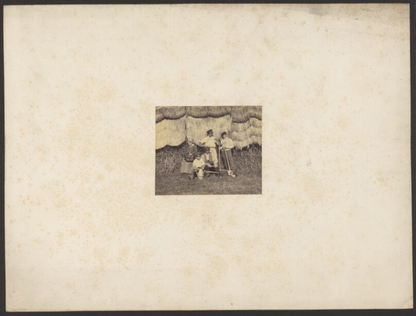[Group portrait with farming tools]