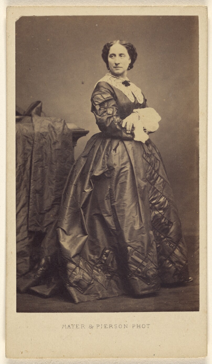 [Unidentified woman standing]