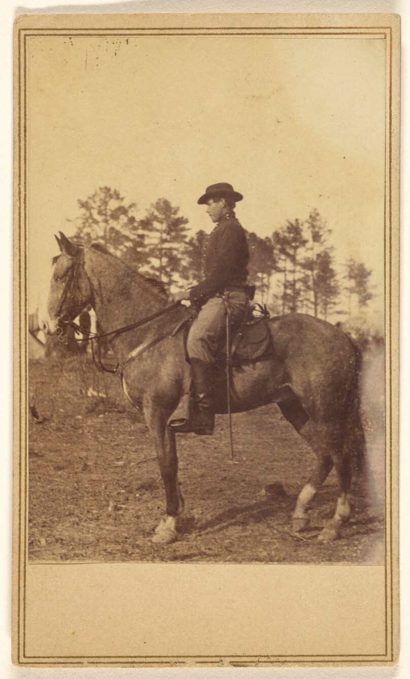 [Man wearing a hat, in profile, on horseback]