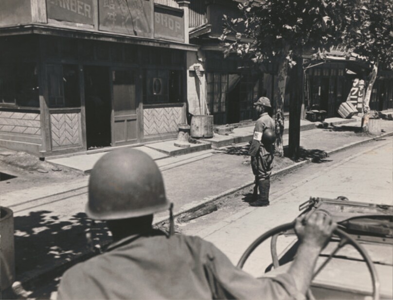 As US Occupation begins in Japan, 1st jeep from Atsugi Airbase on way to Yokohama