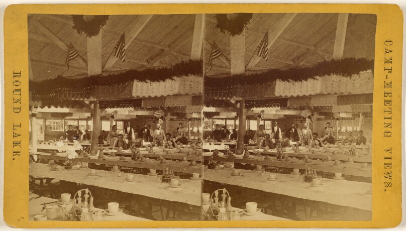 [Group of people inside dining hall with numerous tables, Round Lake, Ballston Spa, New York - Camp-Meeting View]