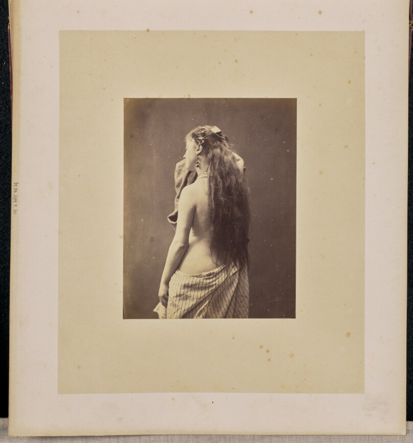 [Half-nude woman]