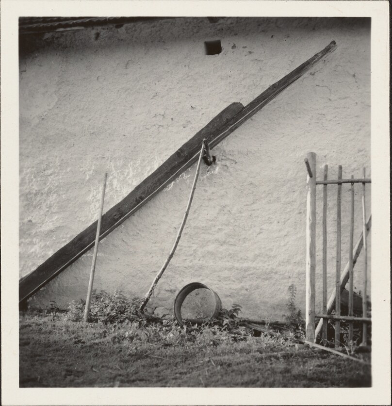 [White wall with fence]