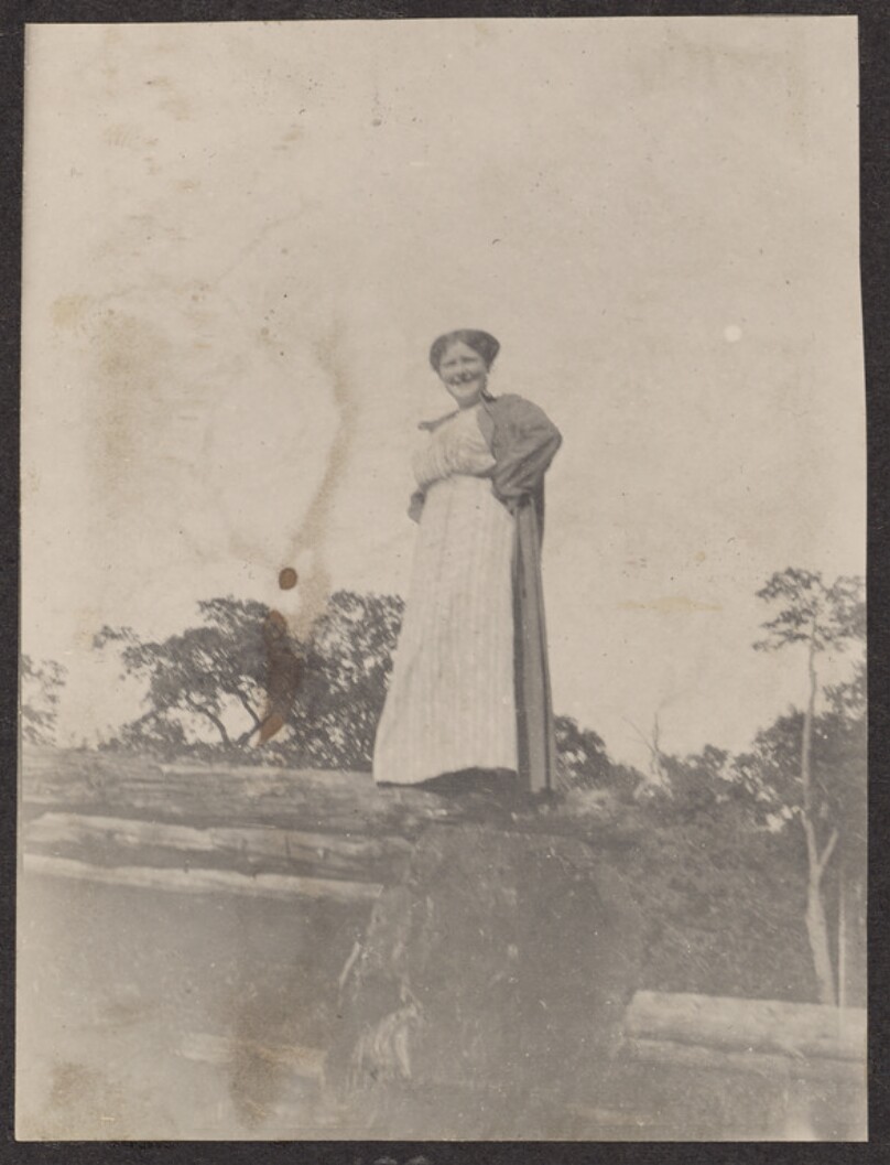 [Woman standing on a rock]