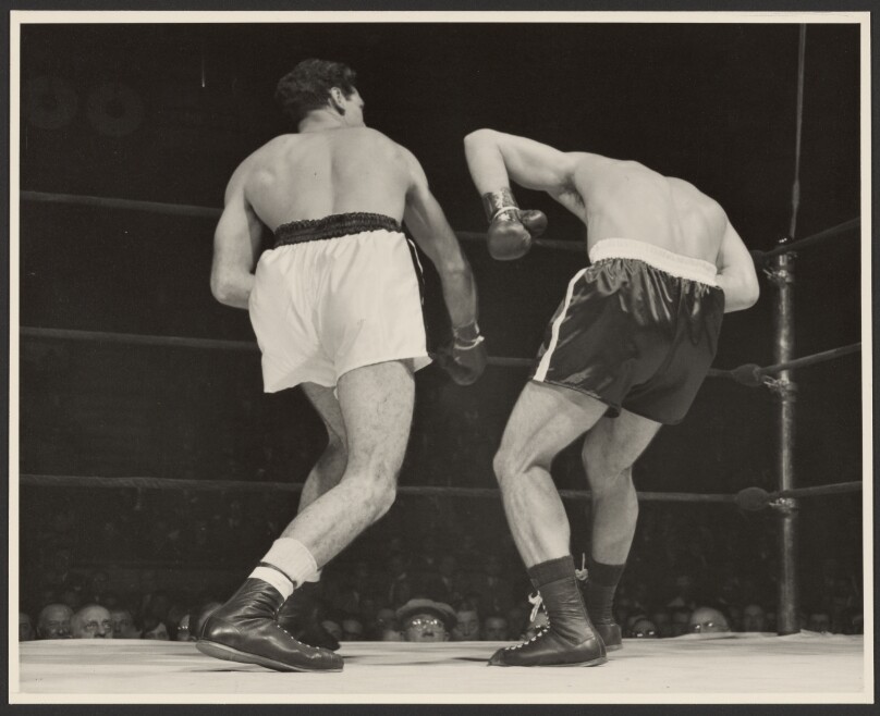 [Two boxers fighting]