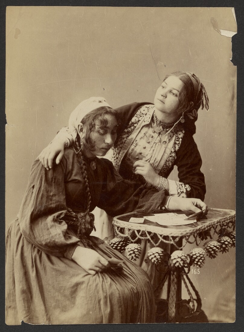 [Two women at writing desk]