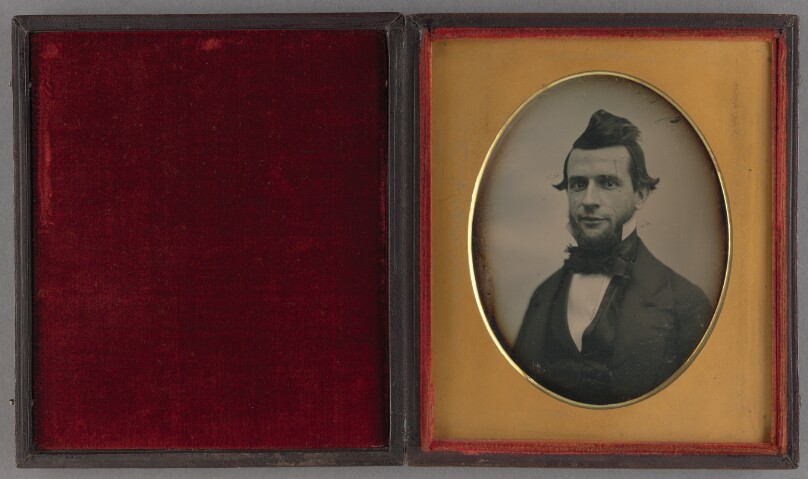 [Portrait of a young man with chin beard and duck-tail coiffure]