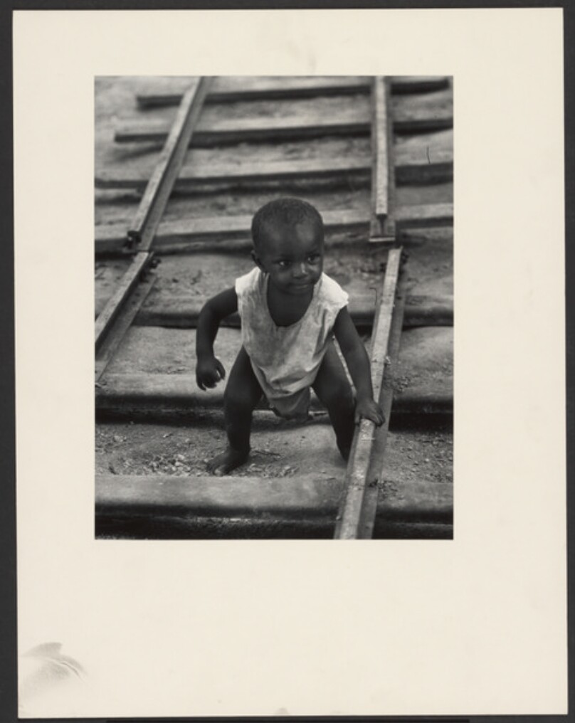[Black Child on Broken Railroad Tracks]