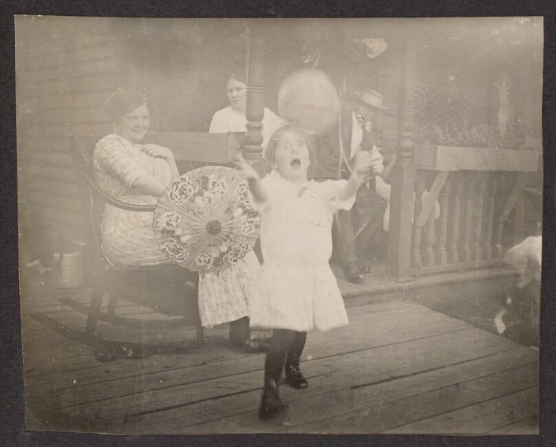 [Child playing with a ball]