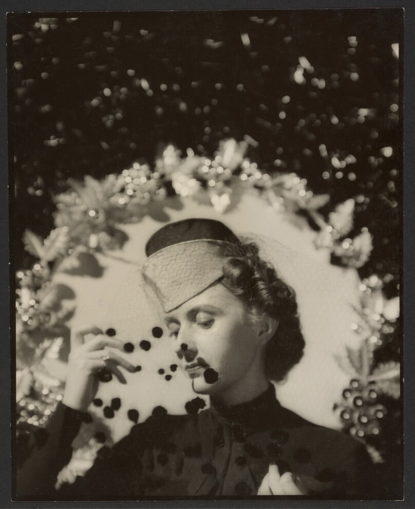 [Woman wearing hat with veil]