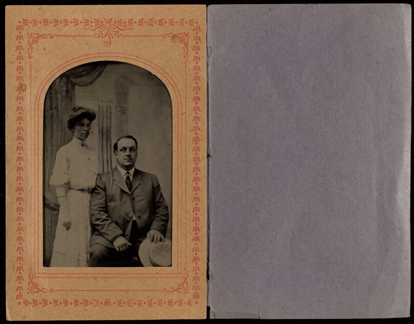 [Unidentified couple: woman standing, man seated holding a hat]