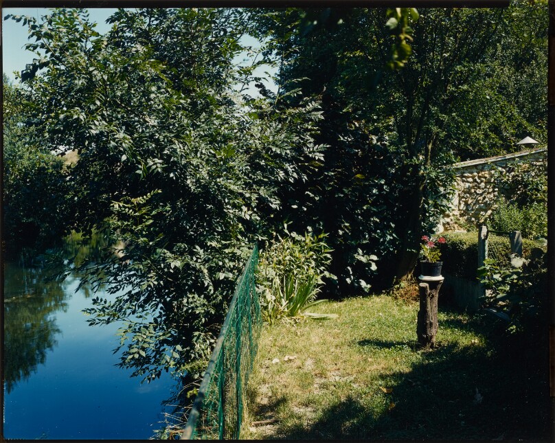 [Fenced yard along River Huisne]