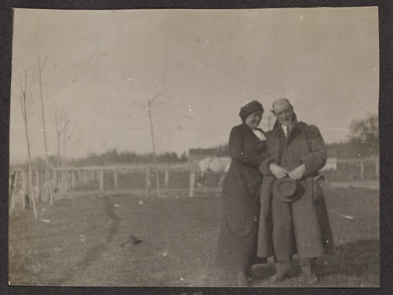 [Man and woman pose]