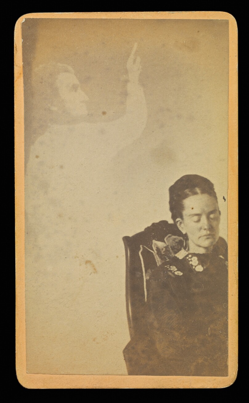 [Unidentified woman with male "spirit" pointing upwards]