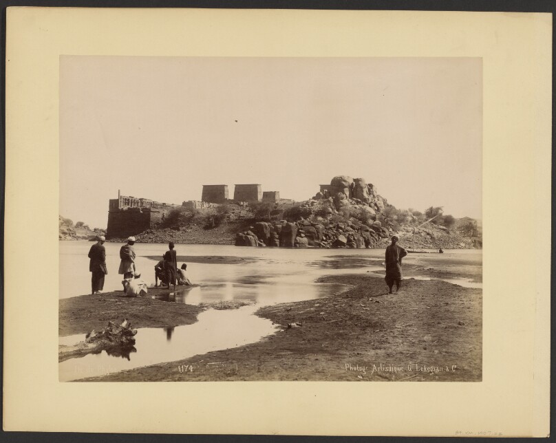 [Group on bank of river]
