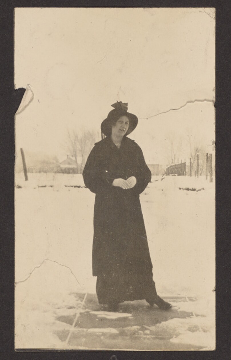 [Woman standing in snow]