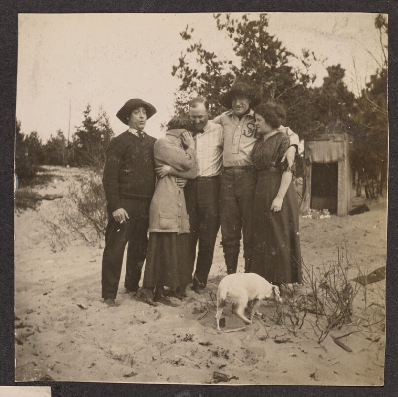 [Group portrait on a beach]
