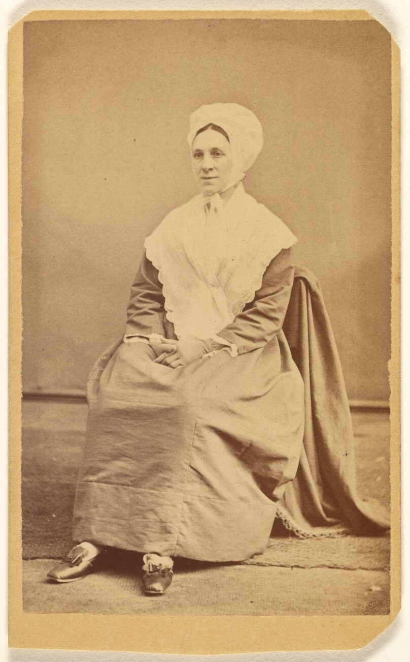 [Unidentified woman wearing a bonnet and shawl, seated]